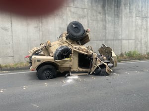 Military vehicle goes over wall on I-90 onto roadway below 1 48862d94d86c70554909ab053b954cbd