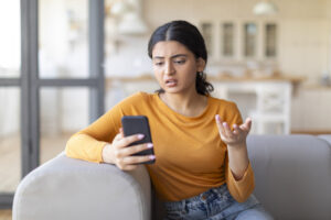 woman phone annoyed stock image